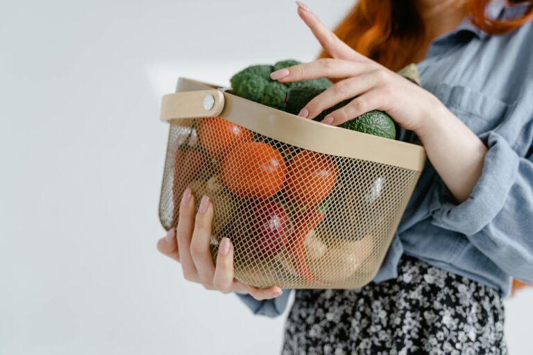 woman holding vegetables in a basket