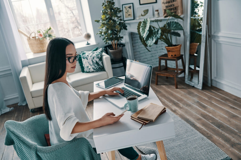 woman sitting at a desk working from home