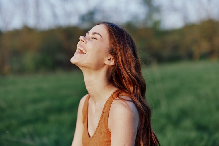 a young woman laughing and smiling