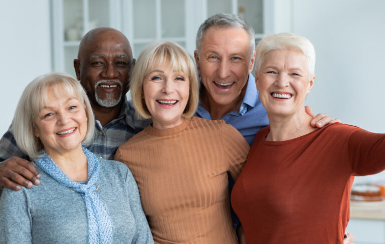 a group of older friends smiling