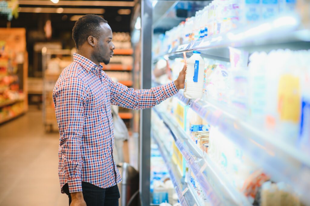 smiling man at a grocery store
