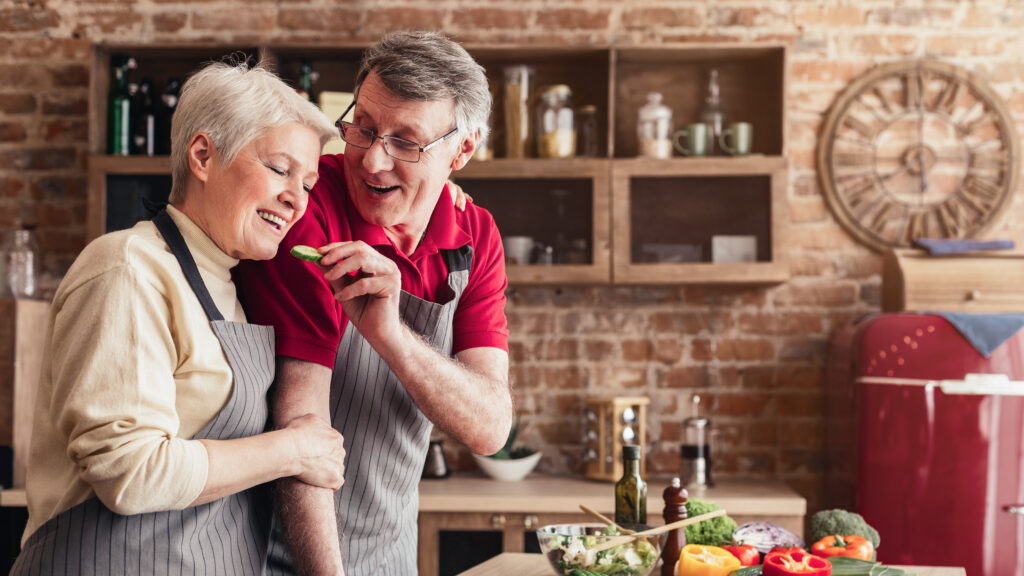 elderly couple cooking in the kitchen