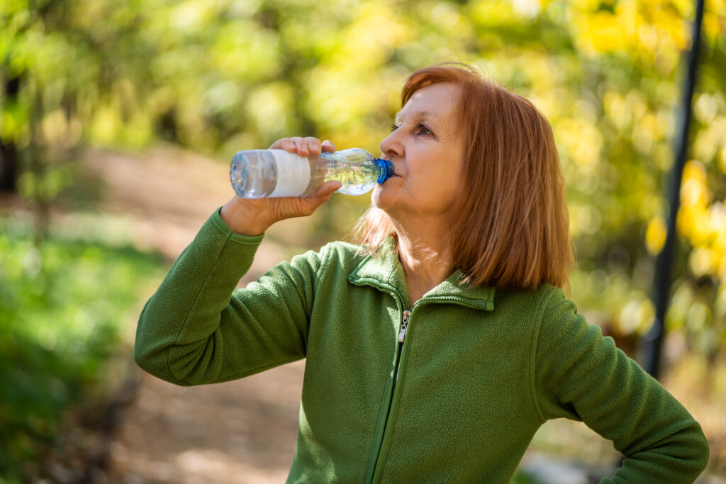 senior woman drinking water