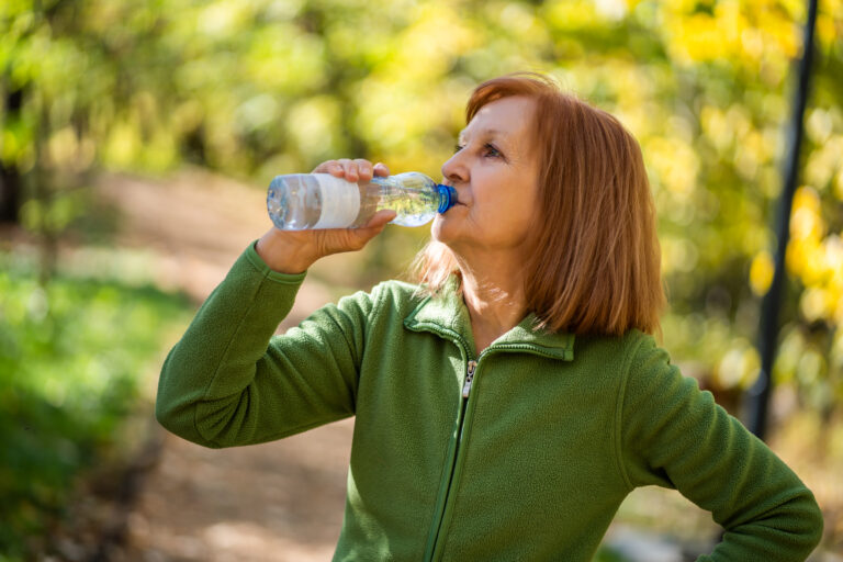 senior woman drinking water